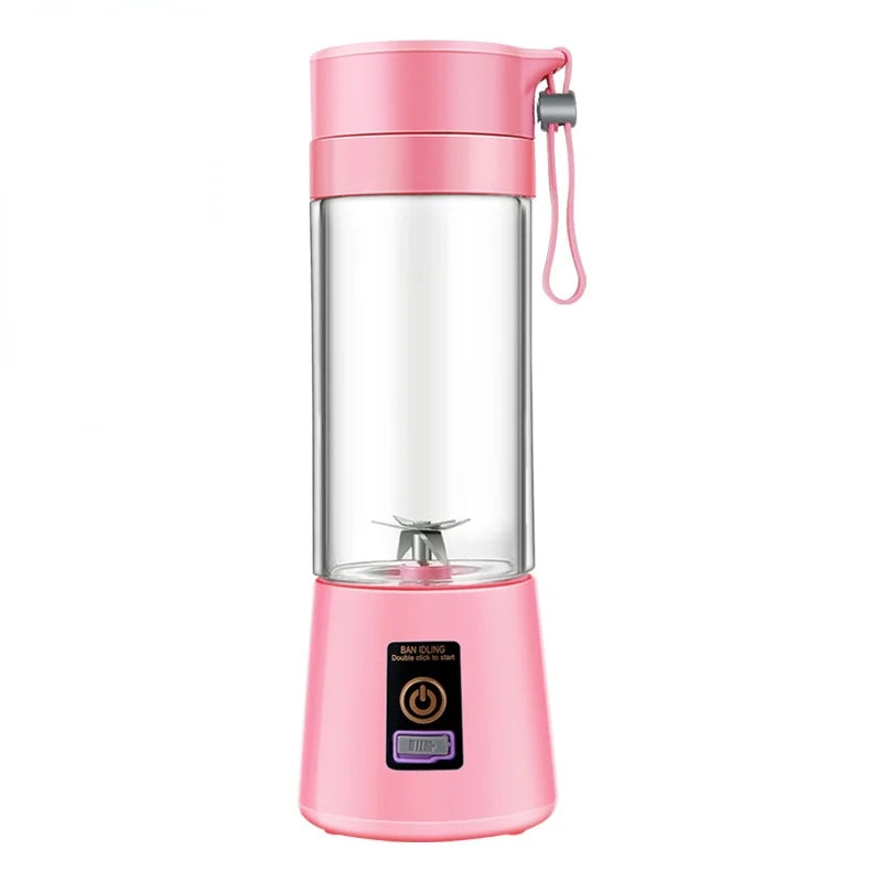 Pink portable blender with clear container on a white background
