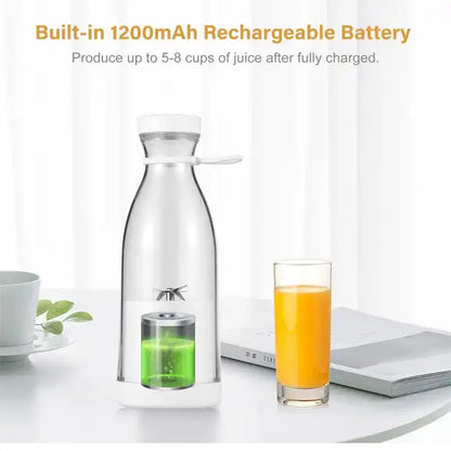 Clear carafe with green infuser and glass of orange juice on a white surface.