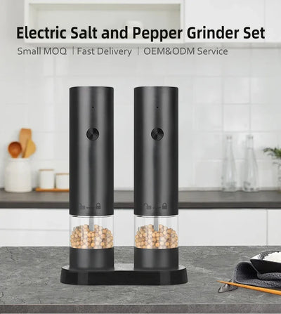 Electric salt and pepper grinder set on a kitchen counter with a white background