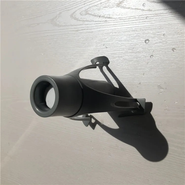 Black metal bracket on a textured gray surface