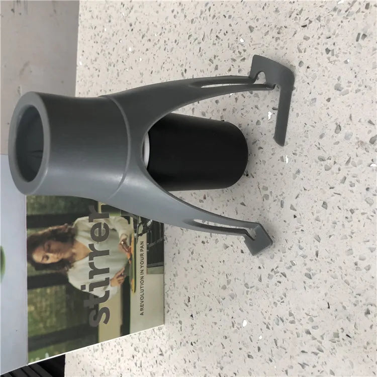 Gray bottle holder on a speckled countertop with a magazine underneath