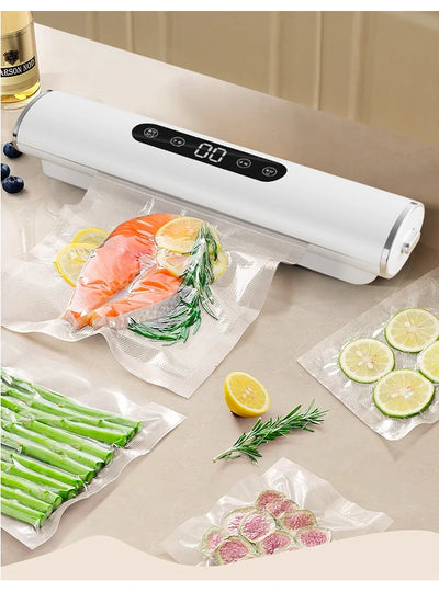 Vacuum sealer with food packaging on a beige surface