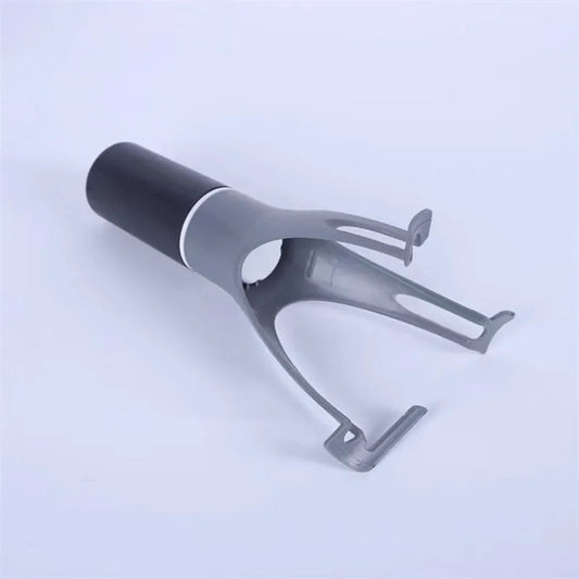 Gray and black metal tool on a light blue background