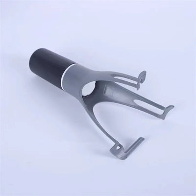 Gray and black metal tool on a light blue background