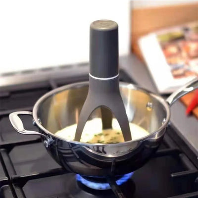 Stirrer on a pot over a stove with food inside